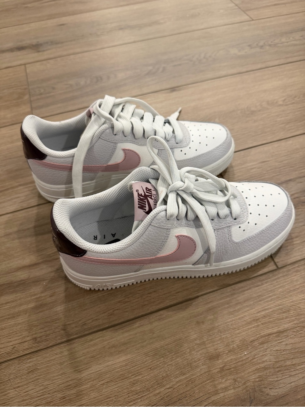 Nike White Sneakers with Pink Swoosh and Maroon Heel